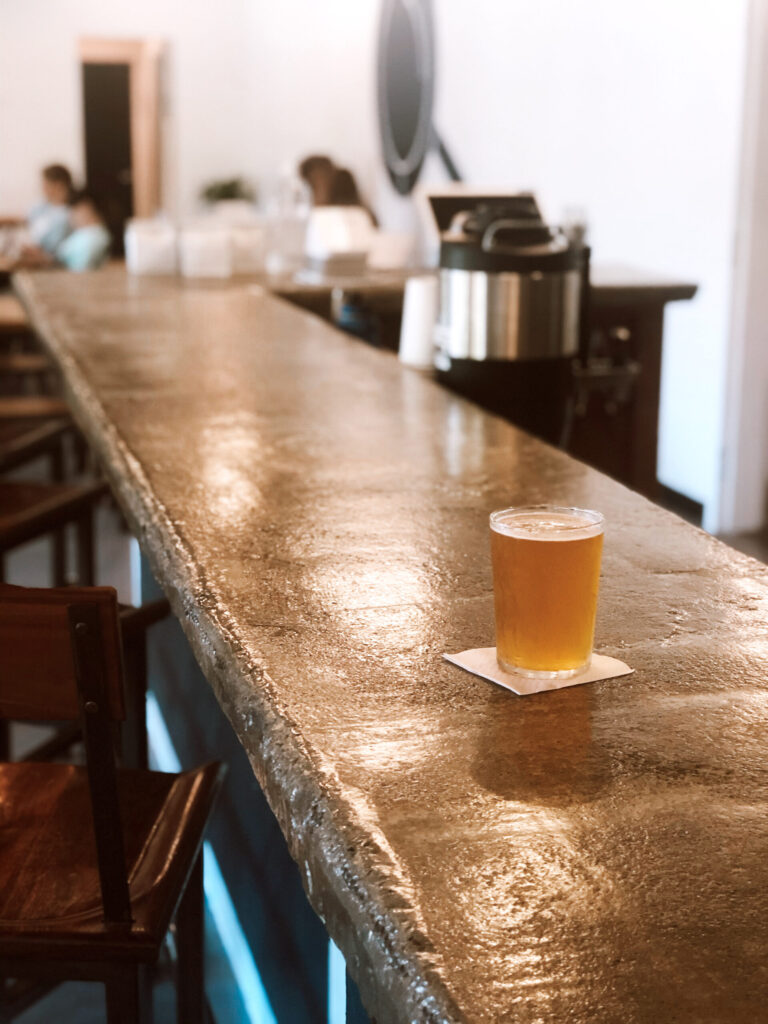 A beer on a bar at Curio Brewing Company